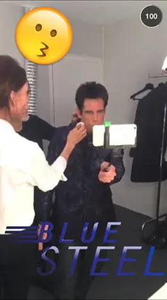 Person taking selfie with a selfie stick and blue steel text overlay.