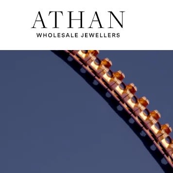 Athan Wholesale Jewellers logo and gold bracelet design.