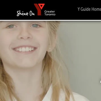 Smiling girl with blonde hair at the Greater Toronto Y Guide