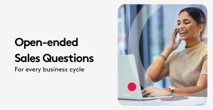 Businesswoman with headset using laptop for open-ended sales questions.