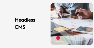 Team discussing headless CMS strategy with notes and tablets on table.