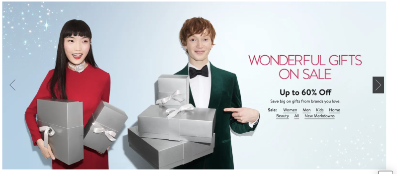 Couple holding gift boxes in holiday sale advertisement with sparkles.