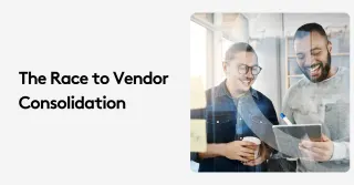 Two businessmen discussing vendor consolidation in an office setting.