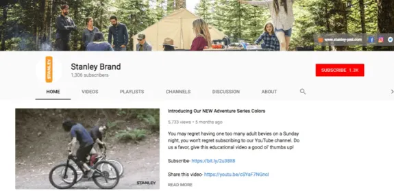 Stanley Brand YouTube channel banner with camping setup in a forest