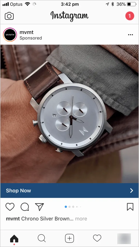 Silver watch with brown leather strap on wrist close-up