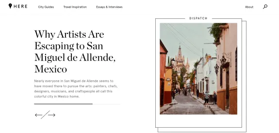 Colorful street in San Miguel de Allende with distant church view.