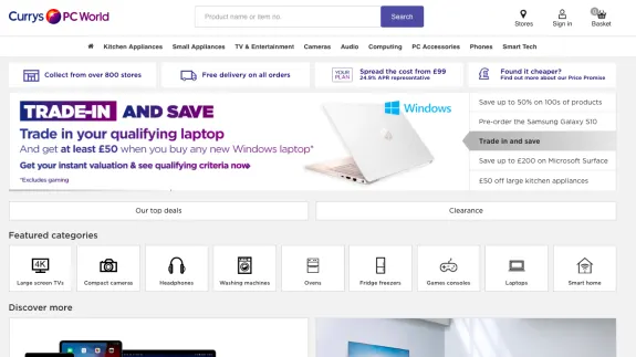 Currys PC World homepage with trade-in laptop offer banner and featured categories.