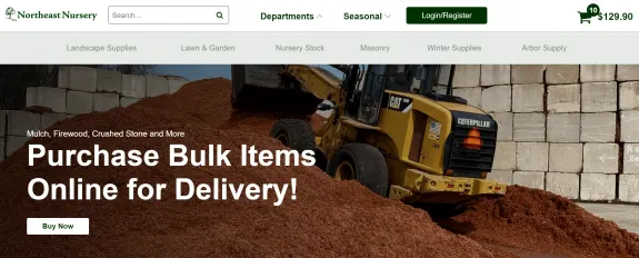 Bulldozer moving mulch at landscape supply store with delivery options.