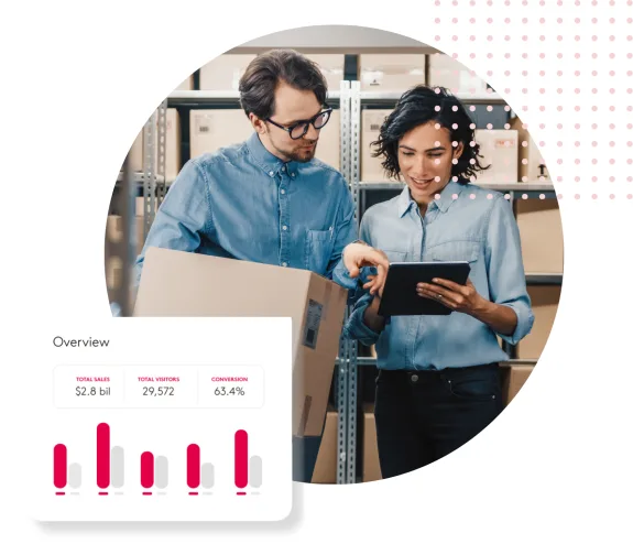 Two people in a warehouse discussing logistics with a tablet and a graph overlay.