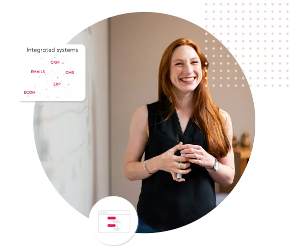 Woman smiling during a presentation on integrated systems with a whiteboard and graphics.